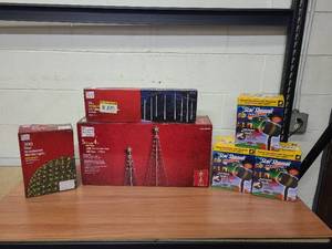 lot 40 image: 5.5 ft & 4 ft Motion Led Pre-lit cone trees, Net Light kit, 18 Twinkling Led Falling Meteor Tube3 Lights (8 pack) and 3 Star Shower Motion Laser Lights - all customer returns.