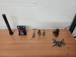 lot 50 image: Mag Lite, Master Lock key box, tail pipe expander, 2 trailer balls 1 78, a engine coil and misc engine hardware