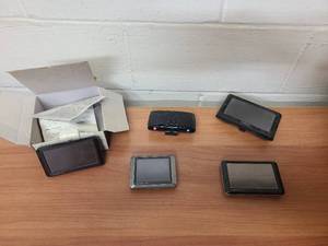 MIsc Garmin GPS units, a Verizon Hum unit and accessories