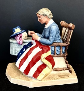 lot 134 image: 1982 Norman Rockwell Porcelain Figure - Mending the Flag - New in Box