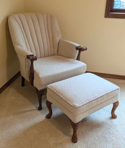 lot 25 image: Beige Upholstered Armchair and Ottoman