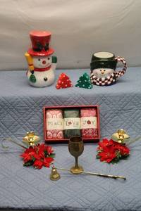 lot 28 image: Holiday Decor Collection with Candles, Bell, and Figurines