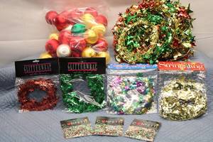 lot 29 image: Assorted Holiday Decoration Supplies Including Ornaments, Garlands, and Confetti