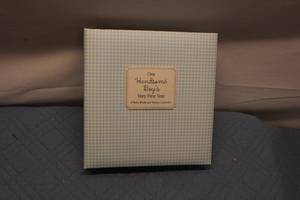 lot 53 image: Hallmark Our Handsome Boys Very First Year Baby Book and Sticker Calendar