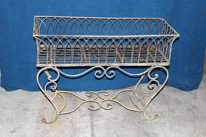 lot 72 image: Vintage Wrought Iron Plant Stand with Decorative Scrollwork