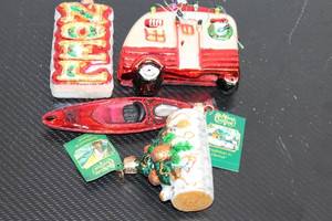 lot 110 image: Set of 5 Old World Christmas Holiday Ornaments including Red Kayak, Vintage Camper, and Noel Sign