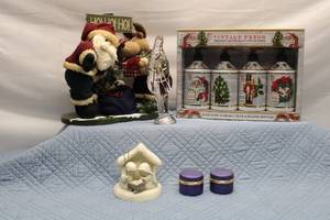 lot 119 image: Assorted Holiday Decorations Including Nativity Set, Santa Figurines, and Holiday Soaps