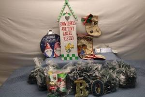 lot 151 image: Holiday Decorations Lot with Christmas Lights, Stockings, and Signs