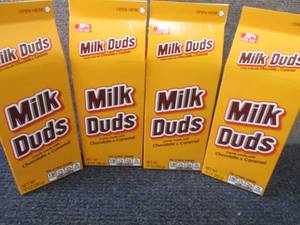 lot 388 image: 4- 10 oz Milk Duds...
