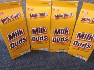 lot 391 image: 4- 10 oz Milk Duds...