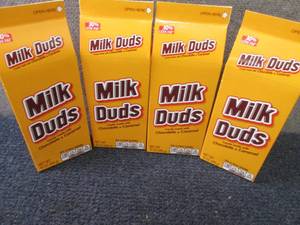 lot 393 image: 4- 10 oz Milk Duds...