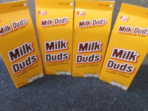 lot 394 image: 4- 10 oz Milk Duds...