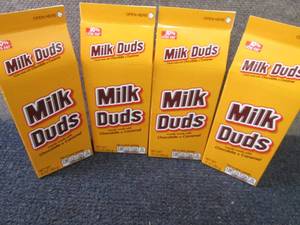 lot 395 image: 4- 10 oz Milk Duds...