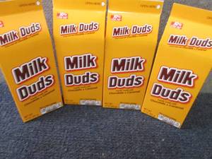 lot 396 image: 4- 10 oz Milk Duds...