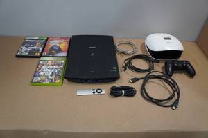 lot 244 image: Assorted Electronics - Canon Scanner, Apple TV Remote, Games