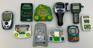 lot 117 image: Misc. Electric Handheld Sports Games & More (Some Vintage)