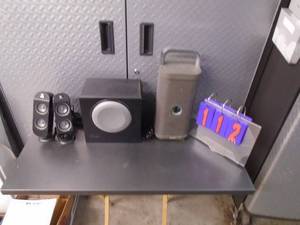 Logitech computer speakers & Brookstone cordless speaker. No power plug. As shown.