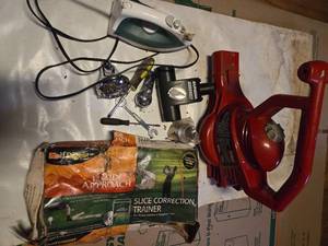 lot 34 image: Lot of Toro blower (Missing the tube), Pressing iron, Eureka carpet cleaner brush, shower head, tools, and Inside Approach Golf Training series, slice correction trainer