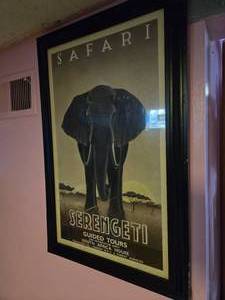 lot 38 image: 20L  x15 W photo frame with and Elephant Safari photo