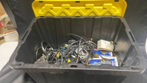 lot 21 image: Storage Bin with Assorted Cables and Light Bulbs