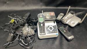 lot 56 image: Lot of 5 Cordless Phones and Accessories - VTech and Uniden
