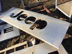 lot 131 image: Large Jeep Metal Sign 82 x 32