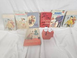 lot 257 image: Kids Books and Snoopy Coin Bank