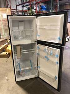 Magic Chef 10.1 cu. ft. Top Freezer Refrigerator in Platinum Steel Slight Damage  Customer Returns See Picture