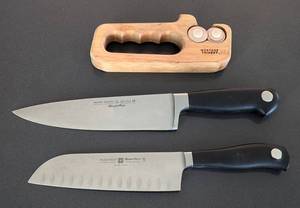 lot 94 image: Pair of Wsthof Chef Knives and Sharpener