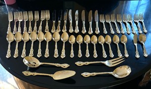 lot 347 image: Supreme Flatware Golden Service for Eight Plus Serving Utensils