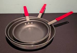 lot 174 image: Three Tramontina Non Stick Pans