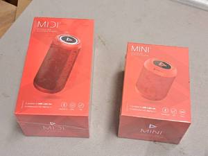 lot 657 image: Lot of (2) ADX Labs Mini2 and Midi2 Outdoor TWS Bluetooth Speakers (New )