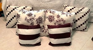 lot 140 image: Six Dark Maroon and White Accent Pillows