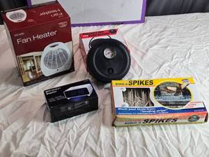 lot 40 image: Lot of 4 Household Items Fan Heater, Portable Air Compressor, Alarm Clock, Bird Spikes
