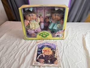 lot 100 image: Cabbage Patch Kids Twin Babies with Magazine