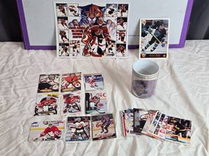 lot 159 image: Vintage Bob Rousseau Minnesota North Stars Coffee Mug and NHL Trading Card Collection