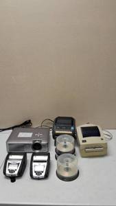 lot 46 image: Zebra Sharp  (4) Zebra Label Printers, (1) Sharp Projector