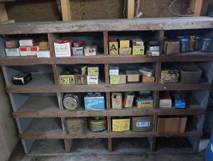 VINTAGE GARAGE SHELF FILLED WITH VINTAGE BOXES OF GOODIES