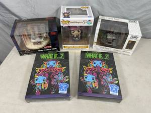 lot 24 image: Assorted New Funko Pop Figurines and T-Shirts