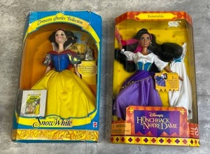 lot 105 image: New Open Box 1997 Disney Princess Stories Collection Snow White Barbie & New Open Box 1995 Disney Esmeralda The Hunchback of Notre Dame Barbie - Some box wear