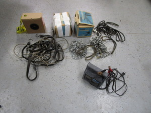 lot 98 image: Battery Charger, Tire Chains, Tarp Straps, Caution Tape