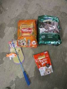 Cat food, treats and a toy...