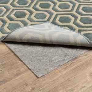 lot 37 image: Home Decorators Collection Complete Gray 7ft. x 9 ft. Dual Surface Non-Slip Rug Pad  Customer Returns See Pictures