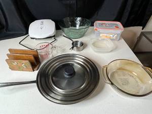 lot 213 image: Mixed Lot of Kitchenware Including Glass Bowls, Measuring Cups, and Cooking Tools