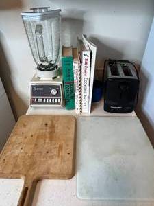 lot 230 image: Countertop Kitchen Appliances and Cookbooks Set Including Blender, Toaster, Cookbooks, and Cutting Board
