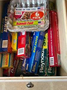 lot 232 image: Assorted Kitchen Supplies Including Aluminum Foil, Wax Paper, and Cake Pans - content quantities unverified