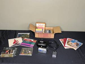 lot 197 image: Vintage Collection of Music Tapes, Magazines, and Olympus Camera with Accessories