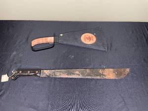 lot 242 image: Woodmans Pal Handcrafted Machete with Sheath - Since 1941