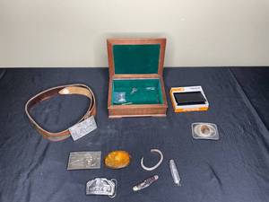 lot 253 image: Vintage Collectible Lot including Belt Buckles, Keychain, and Timberland Wallet