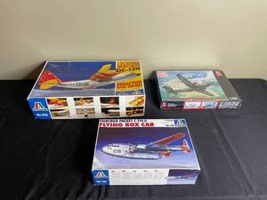 lot 261 image: Lot of 3 Model Kits Lockheed DC-130, Vietnam DHC Caribou, Fairchild C-119 Flying Box Car - contents unverified